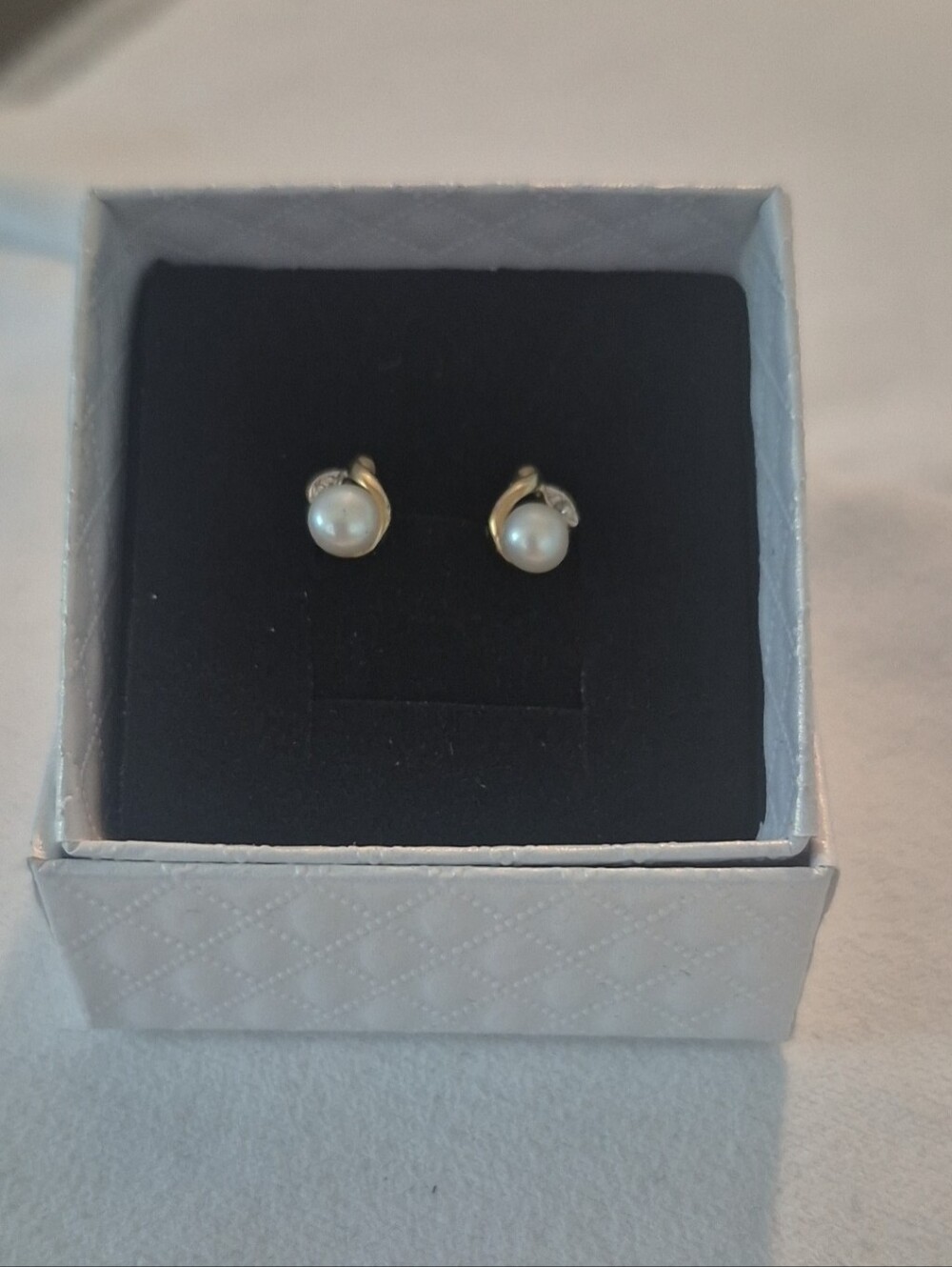 10k solid gold with a small amount of white gold pearl earrings